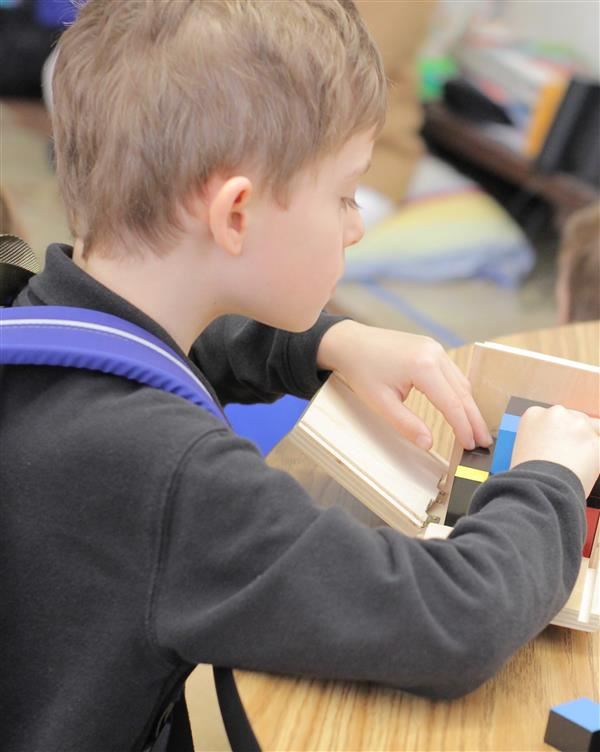 Student works on a puzzle Student works on a puzzle